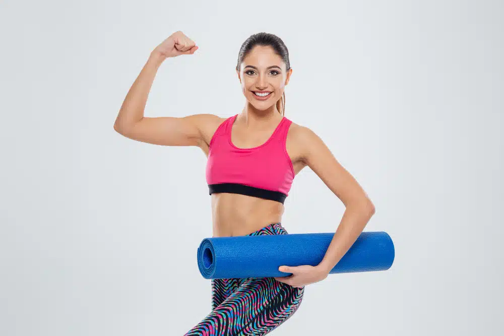 woman with yoga mat exercise for PCOS