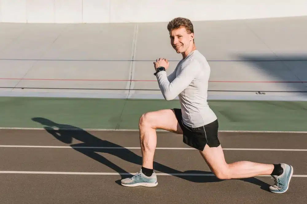 Man doing lunges as plyometric training to prevent tight hip flexors symptoms