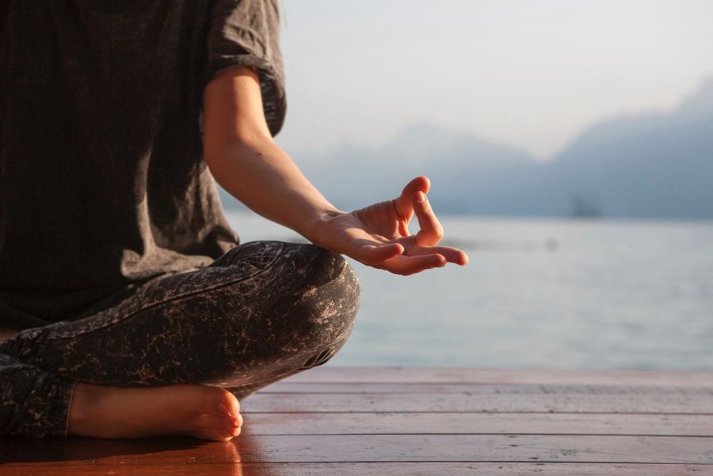 Woman meditating with meditative mind and mindfulness