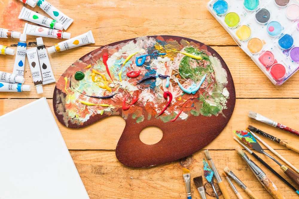 Art Therapy Painting palette with paint tubes and brushes, art as therapy