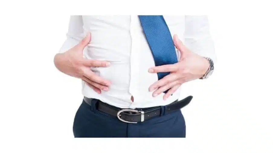 Man with bloated stomach in SIBO symptoms blog - hydrogen vs methane SIBO, hydrogen sulfide SIBO, SIBO vs IBS