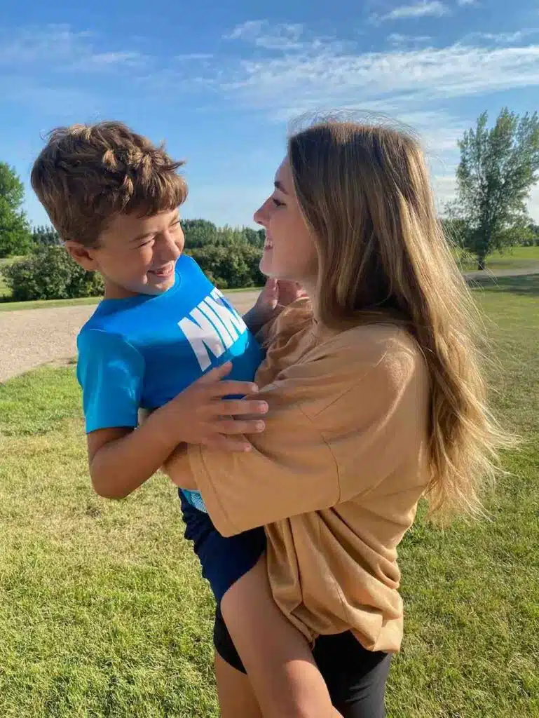 girl holding a small boy at park, cystic fibrosis, CFLD, CFRD
