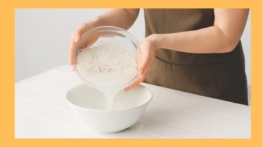 Woman making fermented rice bran or fermented rice water or Rice Kanji