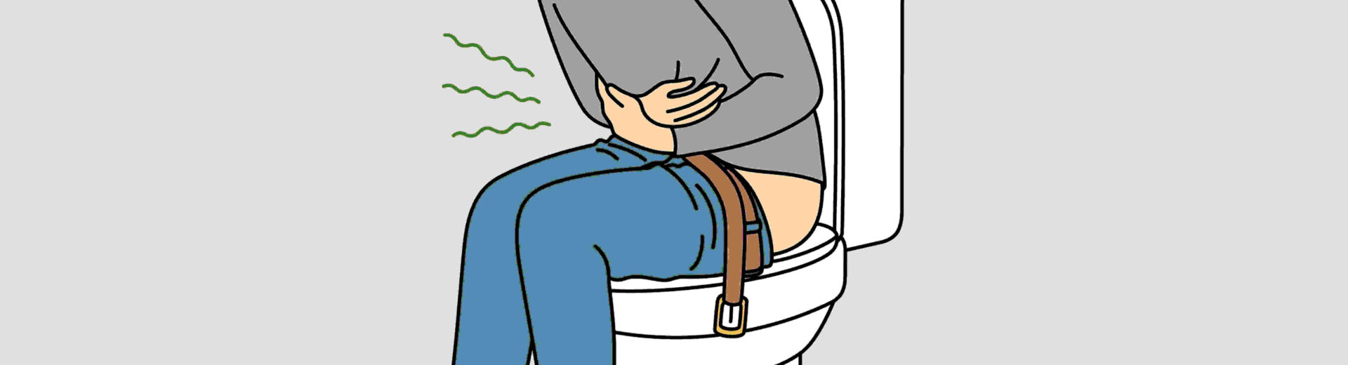 man sitting on toilet seat holding stomach due to chronic idiopathic constipation