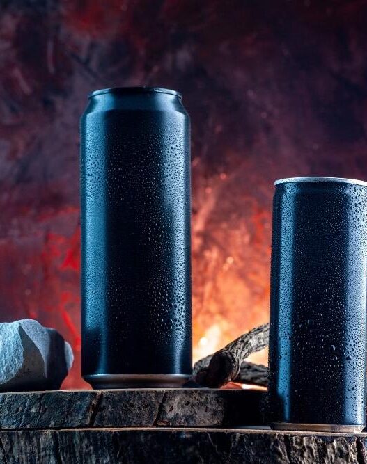 Black Can Energy drinks kept on stone showing side effects of energy drinks