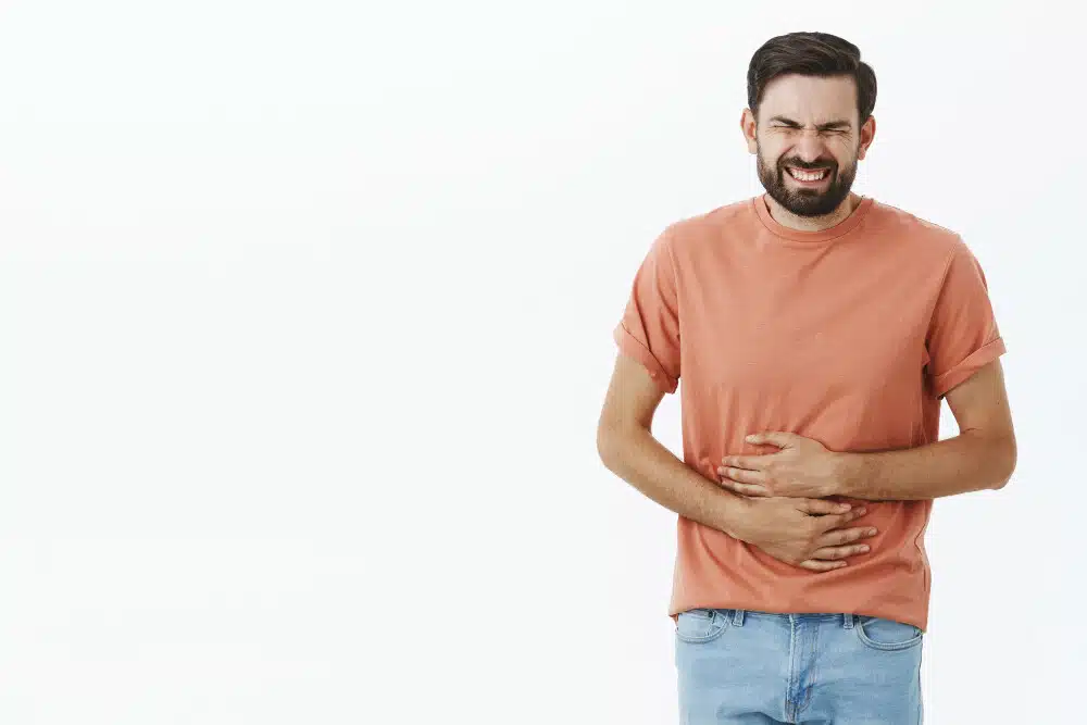Man having stomach pain, gut microbiome and pain