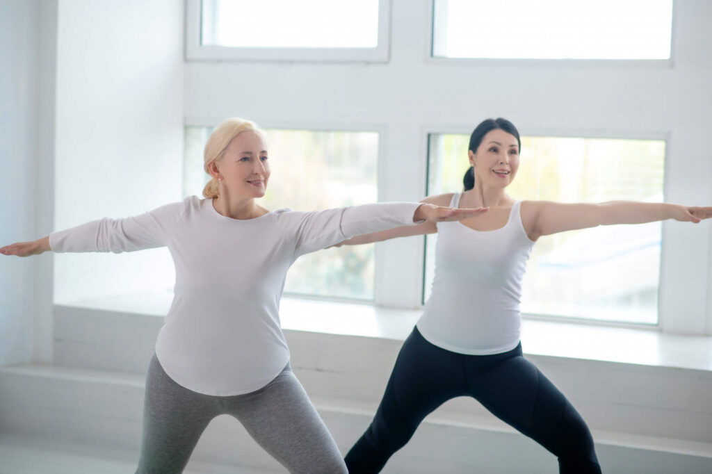 two menopausal woman exercising, exercise in menopause