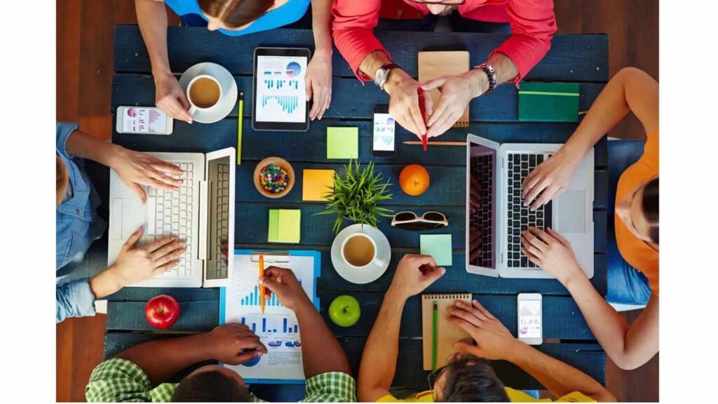 Workplace wellness, healthy office snacks in a square table with laptop, tea