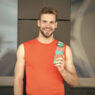 Man drinking Alani Nu Energy Drink