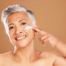 Woman applying Hibiscus and Honey Firming cream by NuSkin reviews, ageLOC dermatic effects