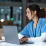 Nurse with laptop, MSN programs online