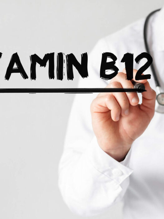 Doctor writing Vitamin B12