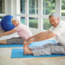 two senior man and woman doing gentle yoga