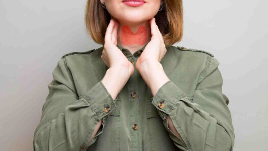 woman showing thyroid gland, thyroid health and weight