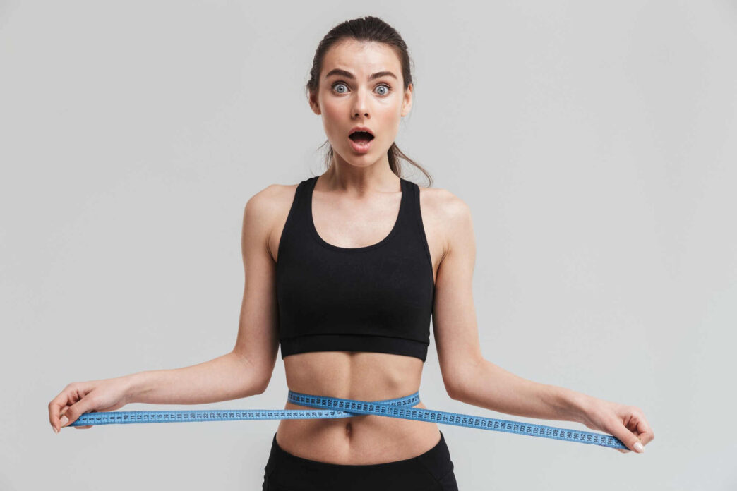 Woman measuring waist with inch tape, K3 spark mineral scam, K3 spark mineral review