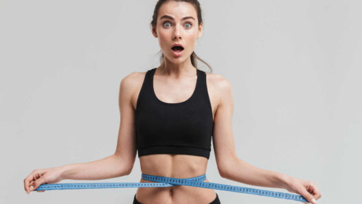 Woman measuring waist with inch tape, K3 spark mineral scam, K3 spark mineral review