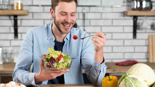 nutritional strategies, man eating bowl of veggies, nutrition male fertility