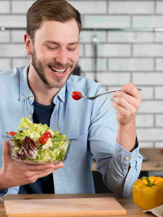 nutritional strategies, man eating bowl of veggies, nutrition male fertility
