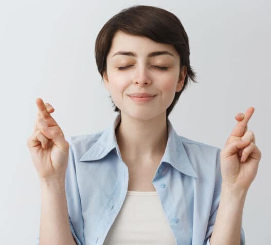 Woman keeping eyes and fingers closed, Happy Mammoth Hormone Harmony Reviews, hormone balance capsules, menopause