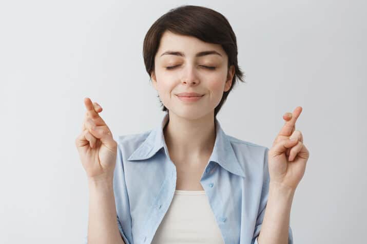 Woman keeping eyes and fingers closed, Happy Mammoth Hormone Harmony Reviews, hormone balance capsules, menopause