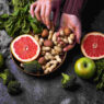 Nutritionism, healthy vegetarian food with orange, peanut, broccoli, apple