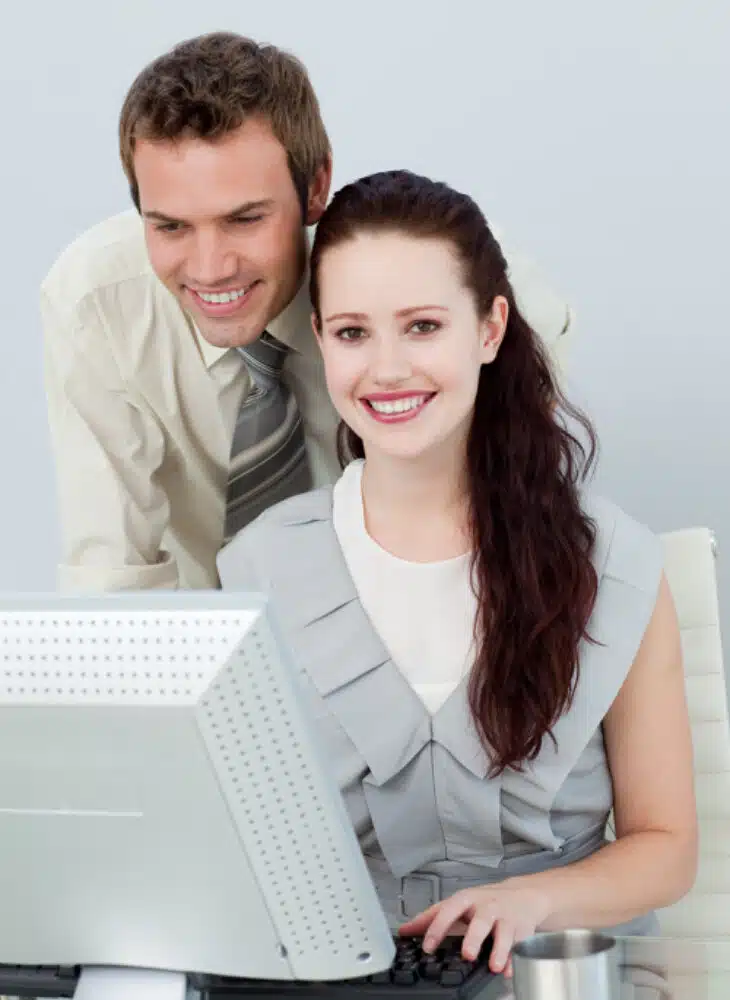 Man and woman looking at computer in healthieyoo holistic health and wellness blogs
