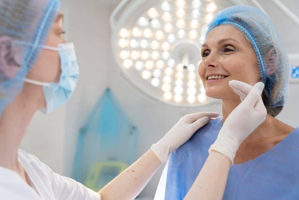 Doctor examining woman for facelift surgery or rhytidectomy
